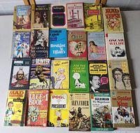 Full lot overview showing 30 vintage paperback books arranged on a flat surface