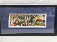 Full view of the framed multicolor abstract acrylic painting with black frame and blue mat.