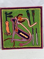 Full view of square Huichol yarn painting with stylized animal figure and multicolor yarn design