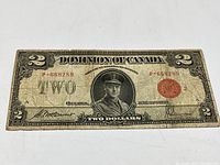 Front of the 1923 Dominion of Canada two dollar bill showing serial number and signatures.