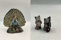 Photo showing the hand painted peacock figurine with colorful feather details and two small musical cat figurines holding instruments