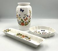 Three-piece set of Aynsley Cottage Garden porcelain including vase and two trinket trays with floral butterfly patterns