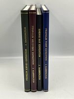 Four hardcover exploration books by John Harrington, spines shown side by side with titles visible.