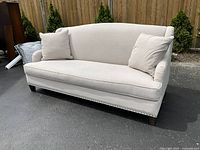 Front view of sofa showing overall design and condition