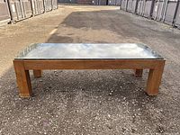 Front view of teak frame with marble top