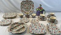 Full lot showing all floral patterned china pieces and Granny teapot.