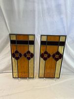 Pair of stained glass panels side by side on white backdrop