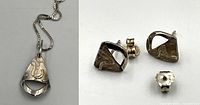 Close-up of necklace pendant and earrings showing design and condition.