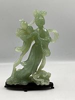 Full front view of jade carving on stand