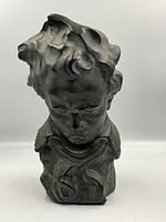 Front view of the Beethoven plaster bust showing sculpted hair, facial features, and detailing on clothing.