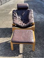 Front view of chair and foot stool outdoors