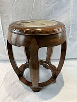 Photo of the vintage wood and marble-top stool showing side angle with marble inset top and wooden knob decoration.