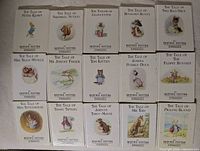 Display of the first 15 Beatrix Potter hardcover books with illustrated covers, titles visible.