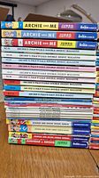 Stack of Archie comic digest magazines showing various titles and colorful spines including Archie and Me Jumbo, Archie Pals 'N' Gals Double Digest, and annual specials.