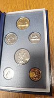 Specimen set showing six Canadian coins in protective blue holder.