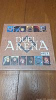 Front of Duel Arena board game box showing title and character art.