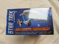 Box front showing U.S.S Enterprise model image, Star Trek branding, 1:1000 scale, Snap-Together model kit, Polar Lights brand.