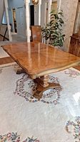 Full view of rectangular table top and pedestal base