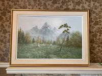 Full front view of the framed landscape painting showing children, sheep, trees, and distant mountains.