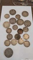 Photo showing all Canadian sterling silver coins arranged on white surface to display overall lot count and condition