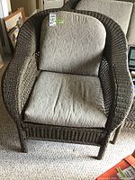 Front view of one chair showing overall shape, cushion and label