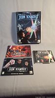 Photo showing the Star Wars Jedi Knight Dark Forces 2 game box, two instruction manuals, and game CD case with disc.