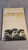 Front cover of the Leonard Cohen Selected Poems 1956-1968 paperback book showing wear and age.