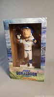 Front view of the boxed Josh Donaldson bobblehead showing figure and packaging design.