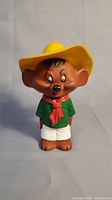 Full front view of the vintage Speedy Gonzales squeaker toy wearing a large yellow hat, green shirt, red scarf, and white shorts.
