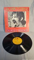 Vinyl record with gatefold cover showing album art featuring Frank Zappa and 'Chunga's Revenge' title.