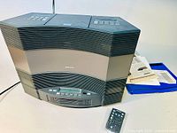 Front view of Bose Acoustic Wave II stereo system with CD changer on top, showing overall condition and design.