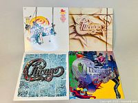 Four Chicago vinyl albums laid out showing front covers with distinct artwork.
