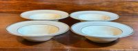 Four Minton's 'Bridal Veil' fine bone china round vegetable bowls nested side-by-side showing shape and design.