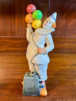 Front view of the Royal Doulton Balloon Clown figurine holding colorful balloons.