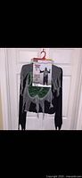Costume robe hanging with packaging card