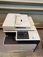 Full view of Canon ImageClass 8280C printer showing control panel, paper tray and overall condition