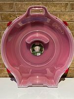 Front view of Sterilite wreath tote showing interior and latch design