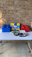 All items on table: two LEGO storage bricks, carry case, three Mayka tape rolls, boxed SkyRover Rebel