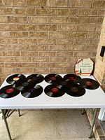 All 12 records laid out with sleeve visible