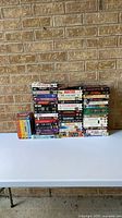 All 50 VHS tapes stacked on table