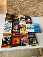 All 13 boxed audiobook cassette sets laid out on table