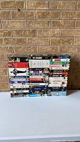 All 41 VHS tapes stacked showing spine titles