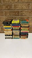 Full stack of three columns of 8-track cartridges showing quantity and general wear