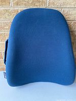 Front view of blue Obus Forme back support cushion