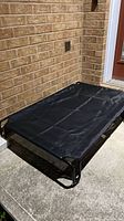 Dog bed fully assembled on patio