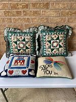 Group shot of all four pillows showing designs and sizes