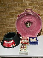 Group shot showing tree stand, wreath case, halo tree top box, three boxes ornaments