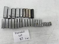 31-piece set of various deep sockets arranged in two rows, chrome metal with some wear and marks.