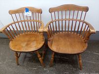 Pair of two maple colonial armchairs side by side showing overall condition and design