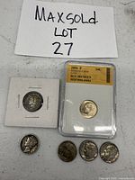 Six dimes including one graded 2006 Roosevelt dime in slab, one Liberty Head dime in cardboard flip, and four additional Roosevelt dimes